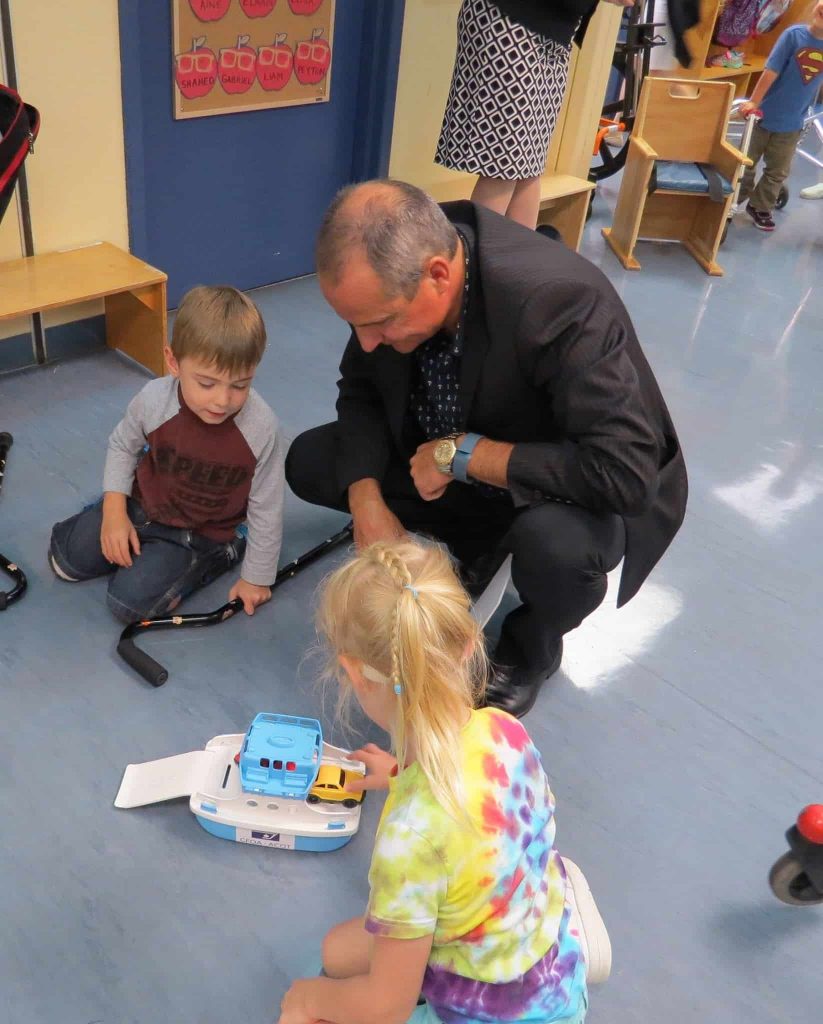 A parent playing with the kids in OCTC