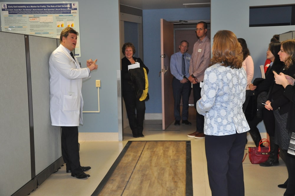 Executive Director of CAHO walks down the sensor mat at clinic