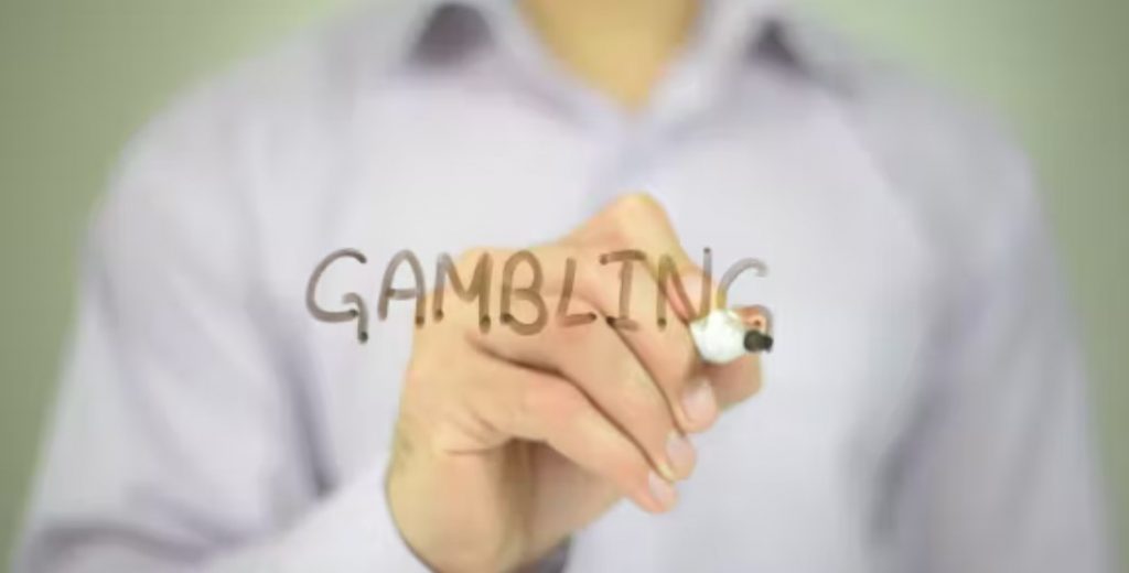 Word gambling written on glass